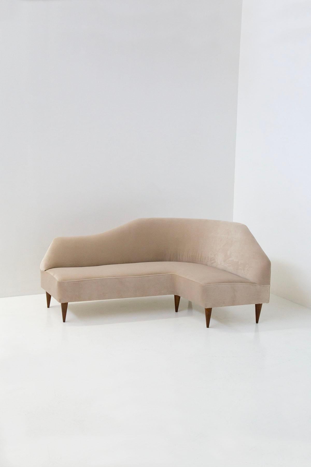 Introducing an exquisite and sophisticated asymmetrical sofa attributed to the esteemed Italian designer, Gio Ponti. Crafted in the early 1950s, this remarkable piece showcases Ponti's renowned artistic vision and impeccable craftsmanship.

The