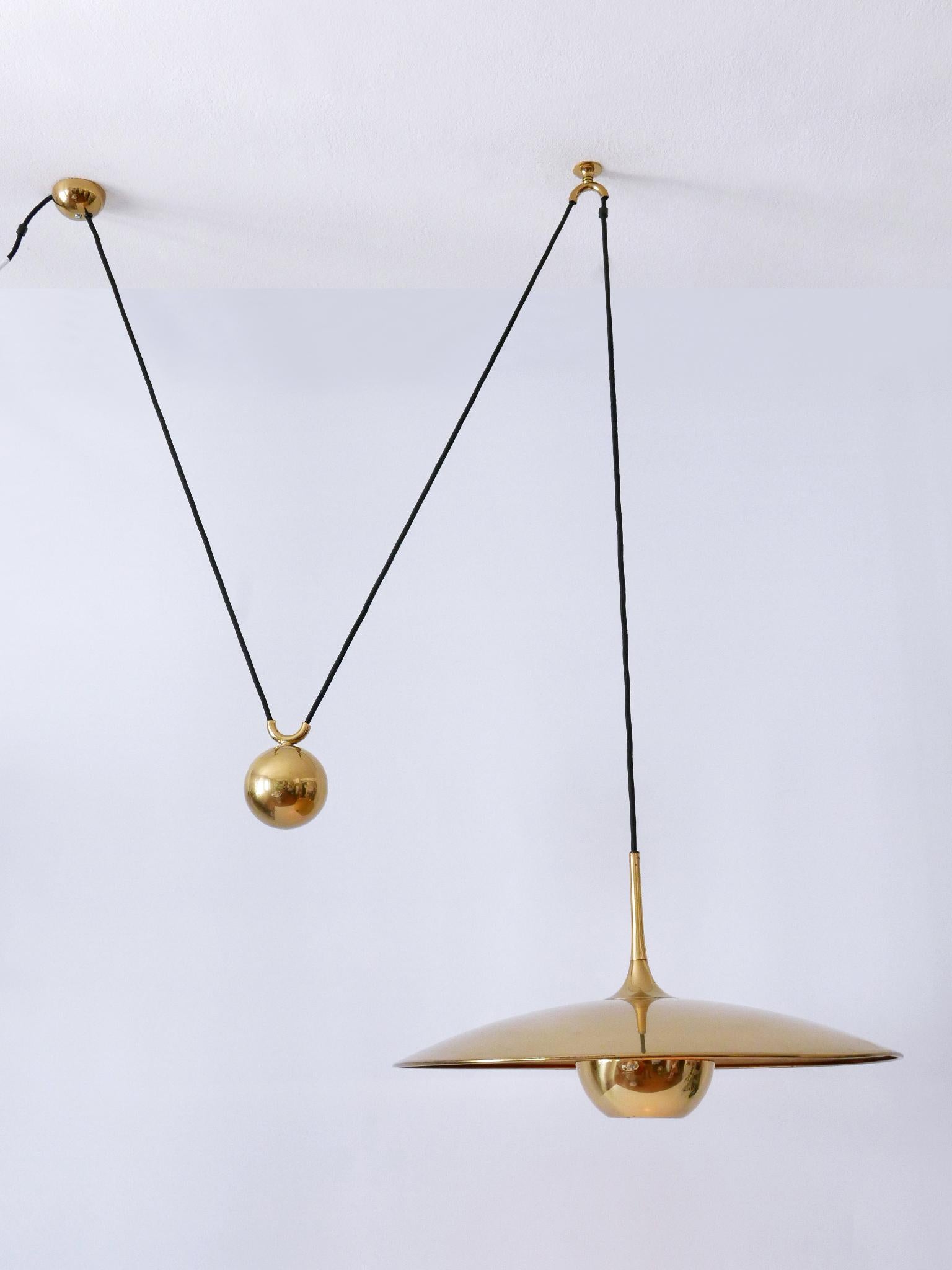 Elegant Mid-Century Modern brass counterweight pendant lamp or hanging light. Model 