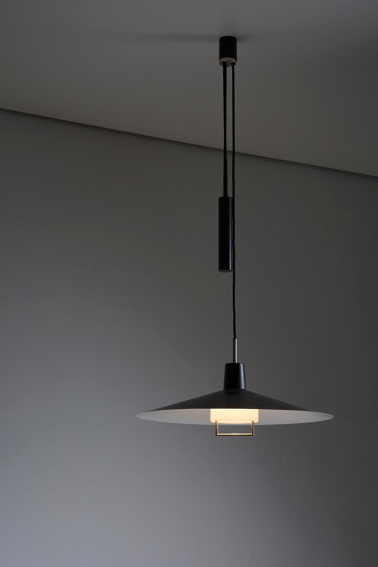 Introducing the Elegant Counterweight Pendant by Metalarte, Spain. This pendant lamp embodies elegance and functionality, making it a standout piece in any interior.

The lamp features a sleek black lacquered shade that exudes sophistication and