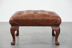 Elegant cowhide chesterfield ottoman