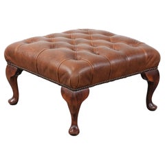 Elegant cowhide chesterfield ottoman
