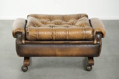 Elegant cowhide English chesterfield ottoman finished with decorative nails