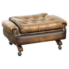 Elegant cowhide English chesterfield ottoman finished with decorative nails