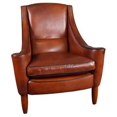 Elegant cowhide leather designer armchair