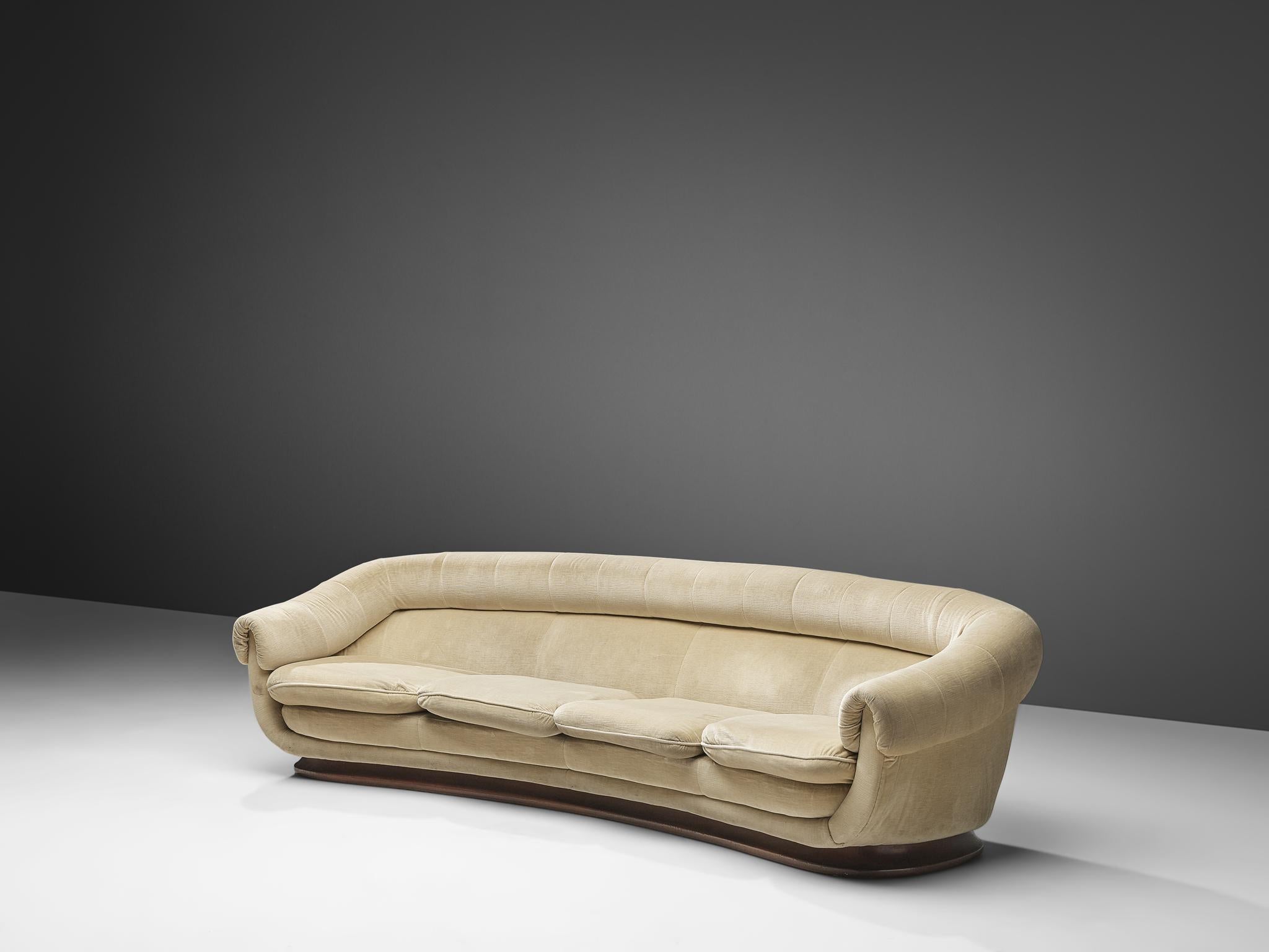 Curved sofa, velvet upholstery, wood, Italy, 1940s

A beautiful curved sofa made in Italy in the 1940s. This sofa bears multiple dynamic features, obviously the the shape of the entire body of the piece that has an elegant curve in it. Secondly, the