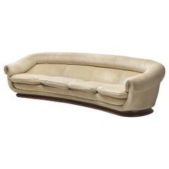Elegant Curved Four-Seat Sofa in Beige Velvet