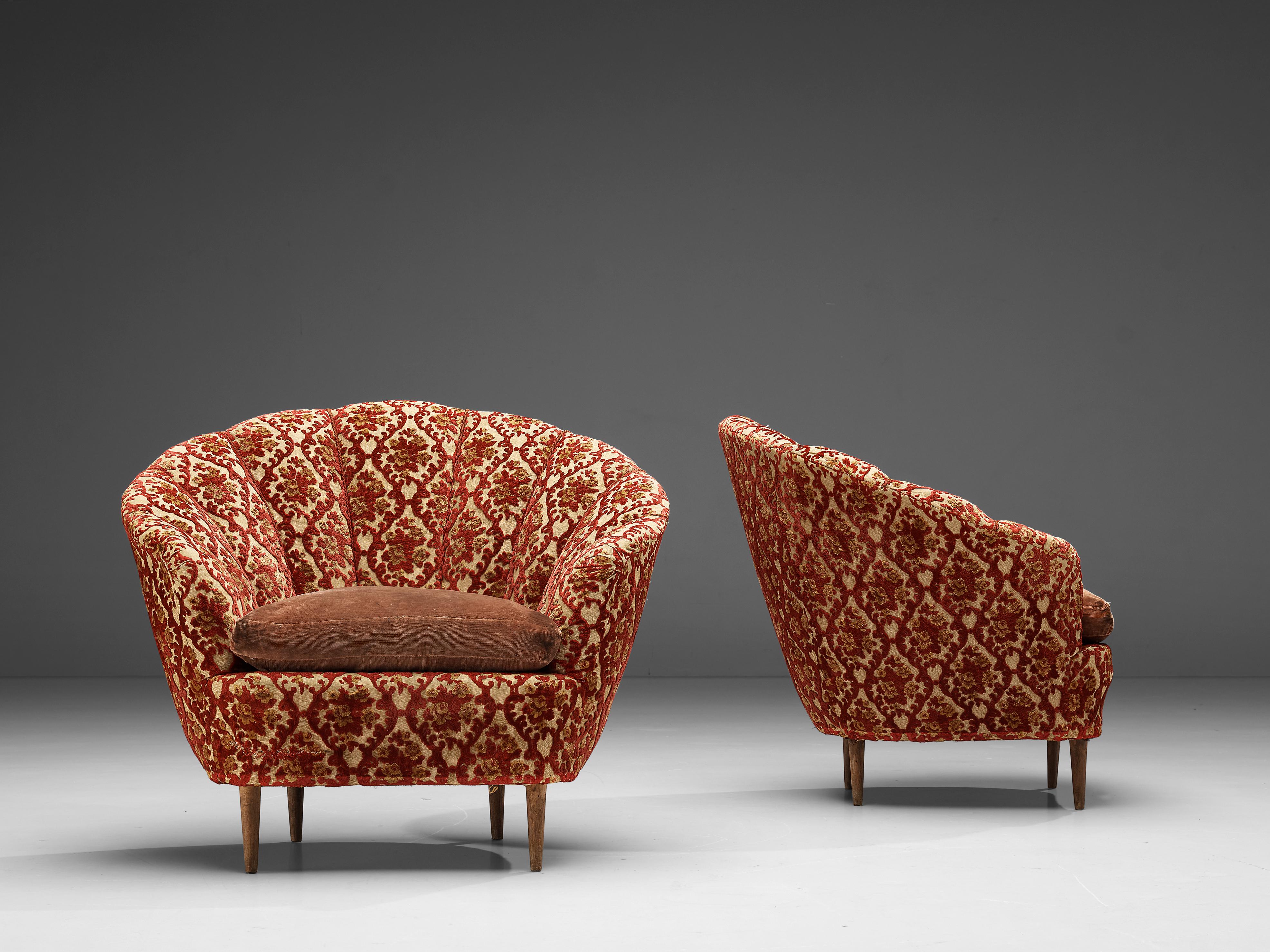 Club chairs, fabric, wood, Italy, 1950s

Classic lounge chairs being a wonderful example of Italian design from the 1950s. The chairs are bold and curvy, yet very elegant. The seating is characterized by bold, curved lines and shapes that contribute