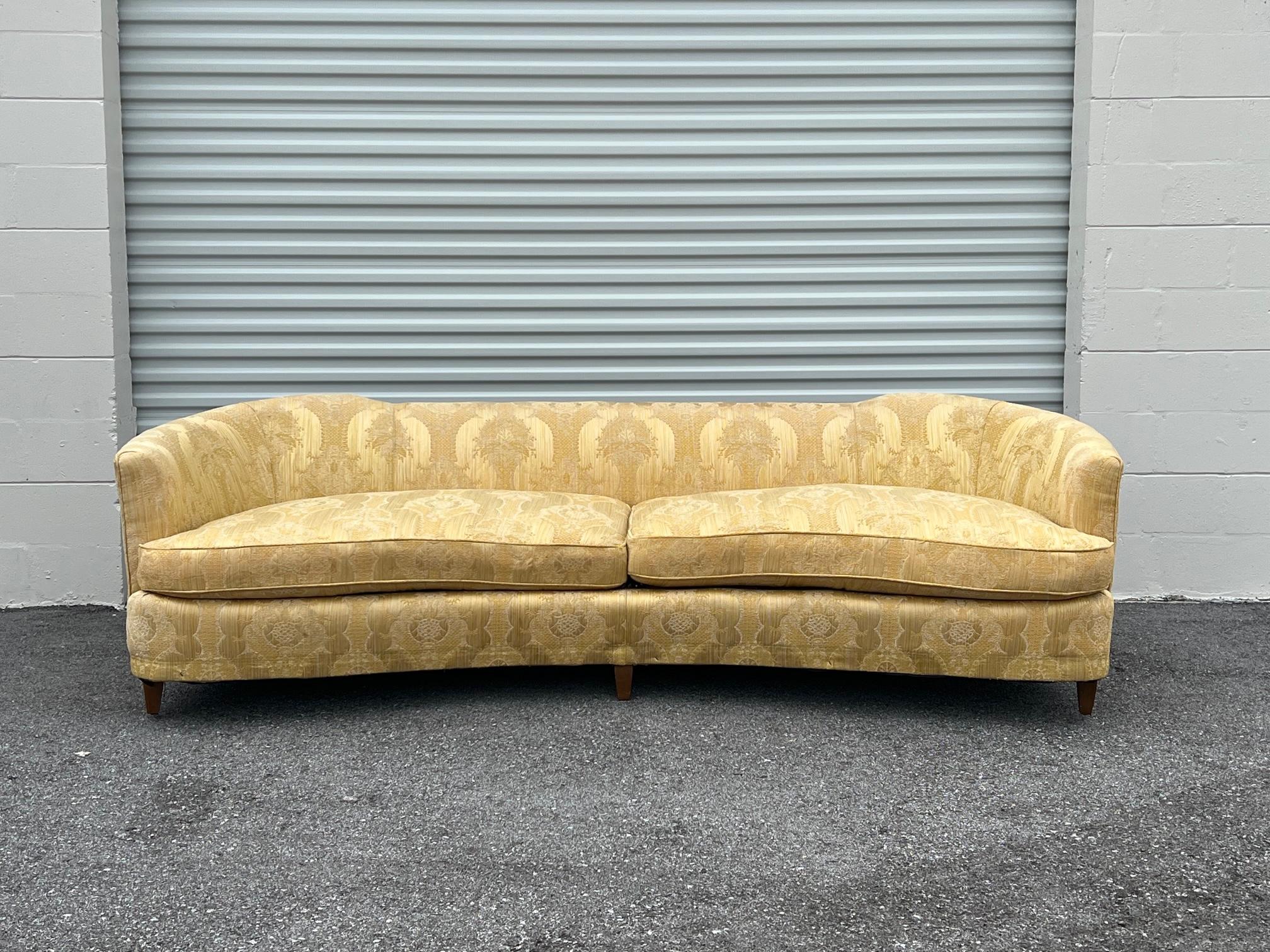 Elegant, curved sofa by Hickory Fry, North Carolina, ca' 1950's. The back has cut downs similar do Dunbar design...Measures approx. 100