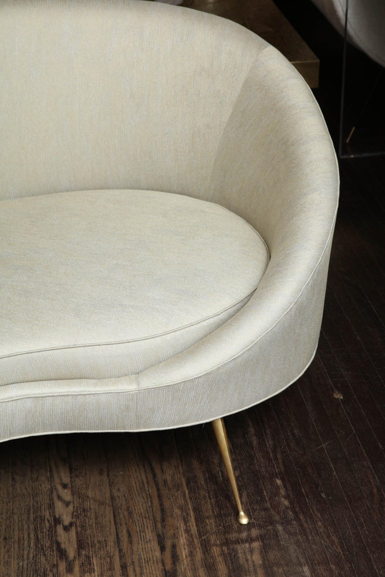 Elegant Curved Sofa in Custom Upholstery with Brass Legs For Sale at
