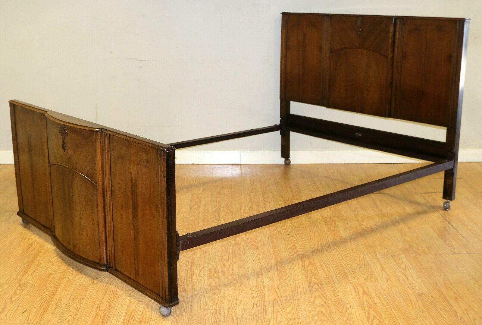 We are delighted to offer for sale this gorgeous C.W.S Cabinet Works Birmingham walnut double bed frame on wheels.

This piece is a part of a suite, which includes a ladies' wardrobe, dressing table and double wardrobe. This bed frame is well