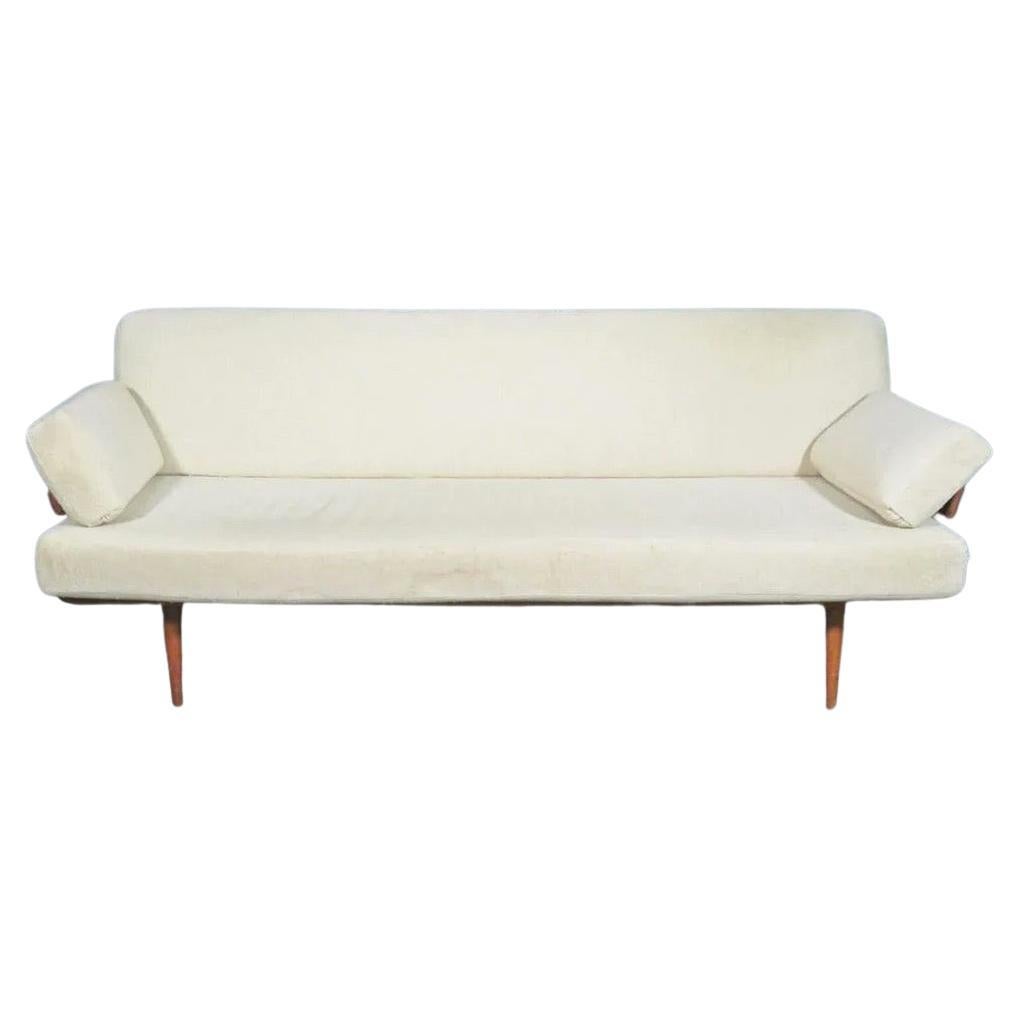Paired with a minimal Danish design, teak legs and cream colored upholstery make this vintage sofa by France & Sons truly unique. Please confirm item location with seller (NY/NJ).