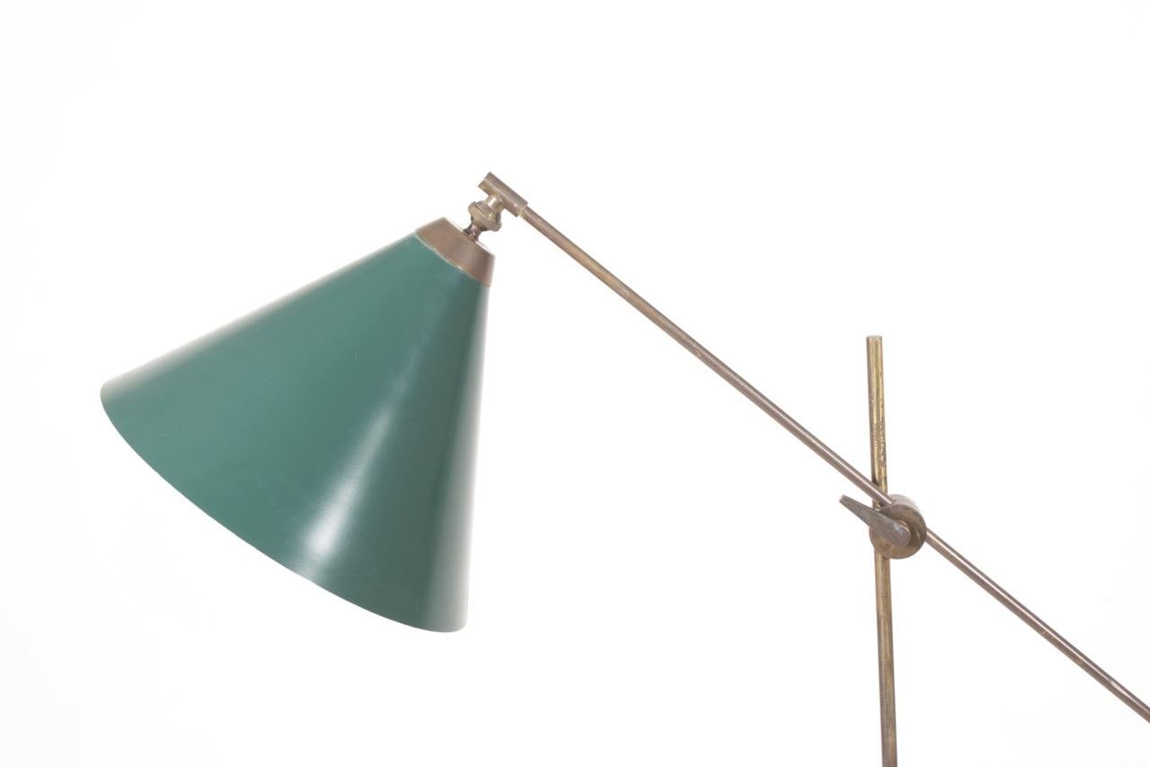 Danish floor light in patinated brass, adjustable height and shade. Designed and made for Th. Valentiner in the 1940s-1950s. Great condition.