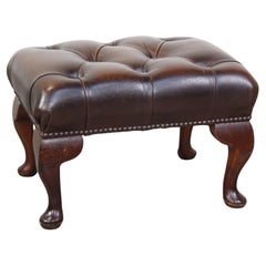 Elegant, dark brown cowhide leather Chesterfield ottoman