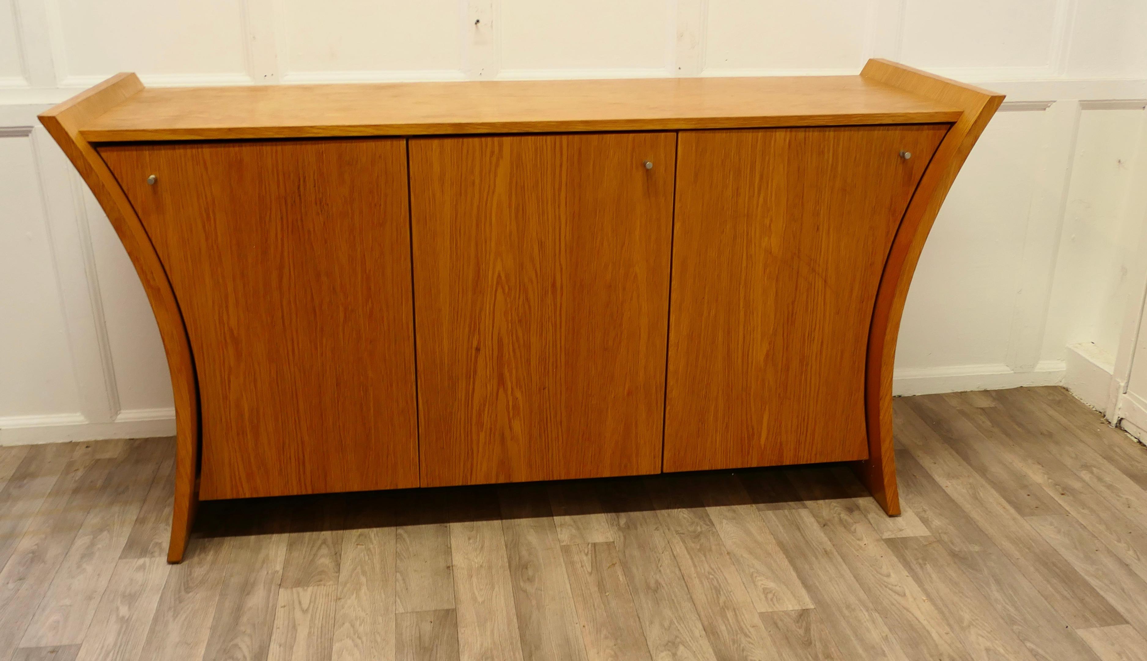 Elegant Designer 3 Door Sideboard in Golden Oak


This elegant practical sideboard has a waisted shape to the sides
The sideboard has one, 1 door smaller shelved cupboard and a double size shelved cupboard next to this 
Due to the fine quality of