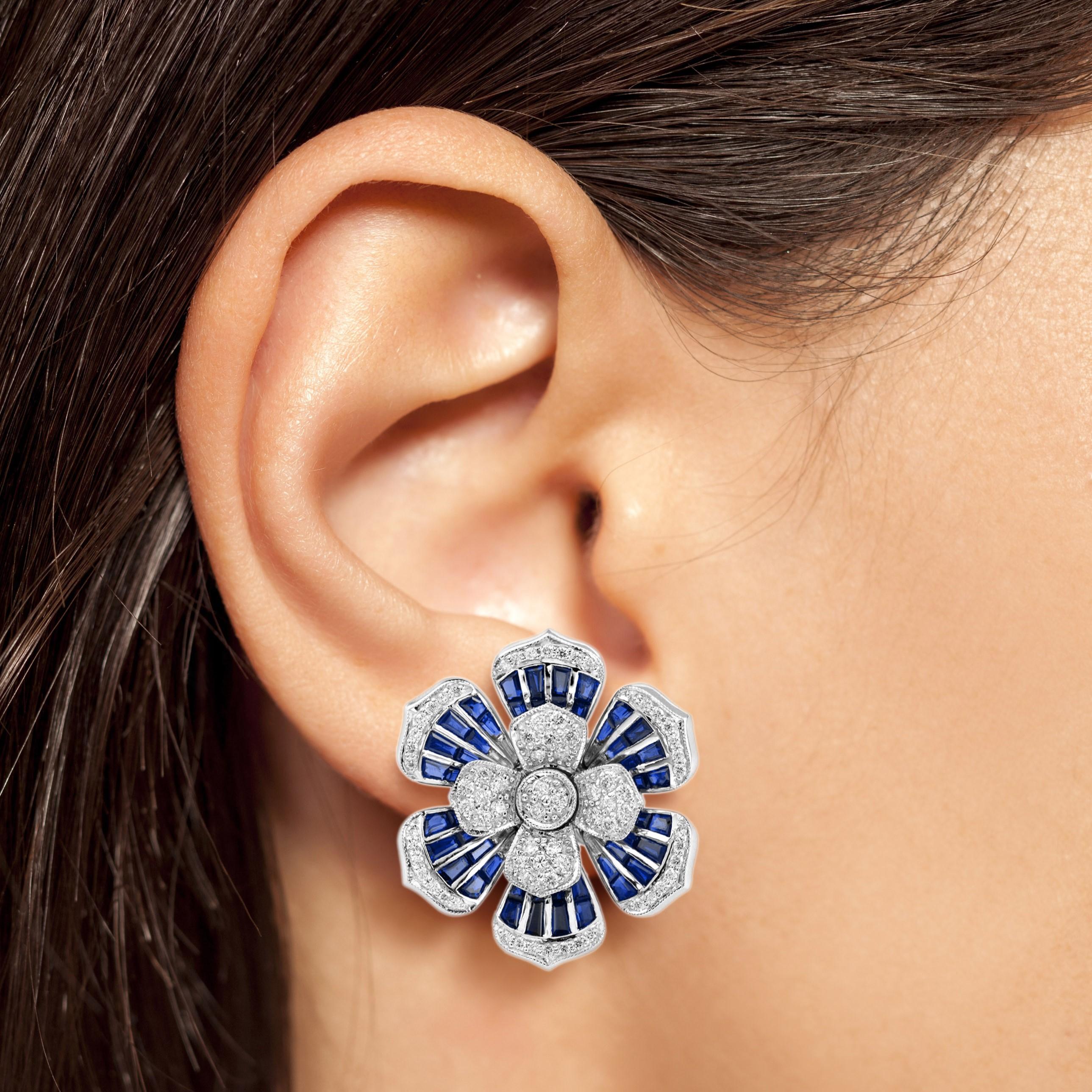 Shine bright with these stunning diamond and sapphire earrings. The earrings features 146 round cut diamonds and 96 French cut blue sapphires. These magnificent and timeless earrings would add a touch of grace and elegance to any occasion!

Earrings