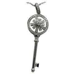 Elegant Diamond and Gold Key Pendant