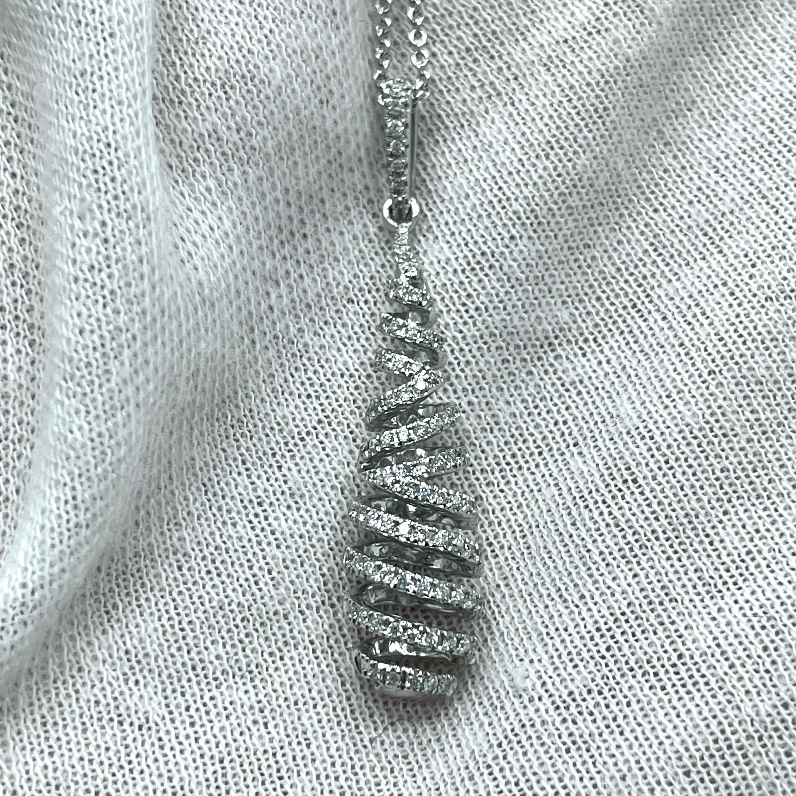 An intricately designed pendant with 0.25Ct of diamonds set in white gold. 