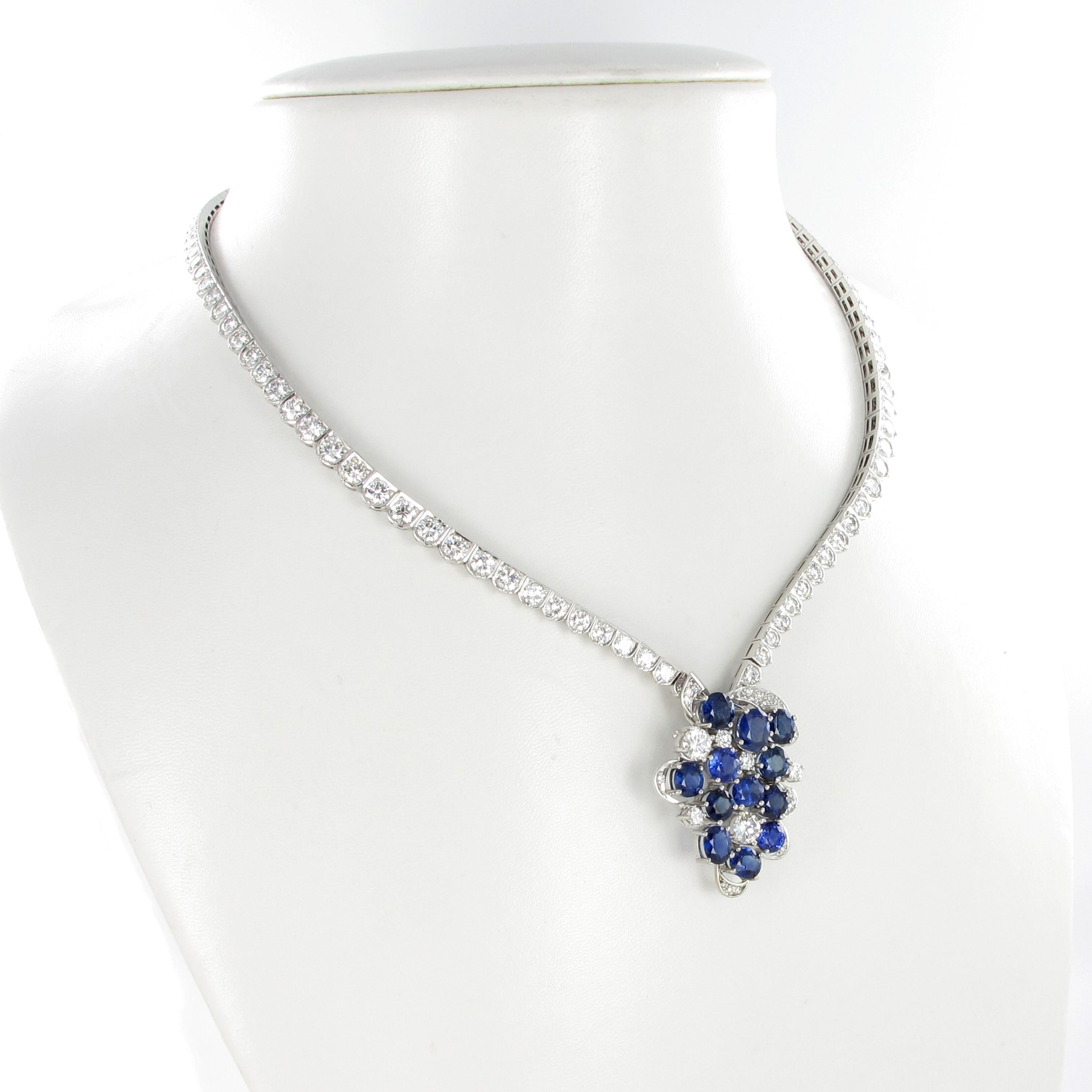 This beautiful necklace is handcrafted in 950 platinum and set with 12 oval shaped and lively colored sapphires, total weight approximately 11.00 carats.
In addition, pendant and necklace are set with 135 brilliant-cut diamonds of G/H color and