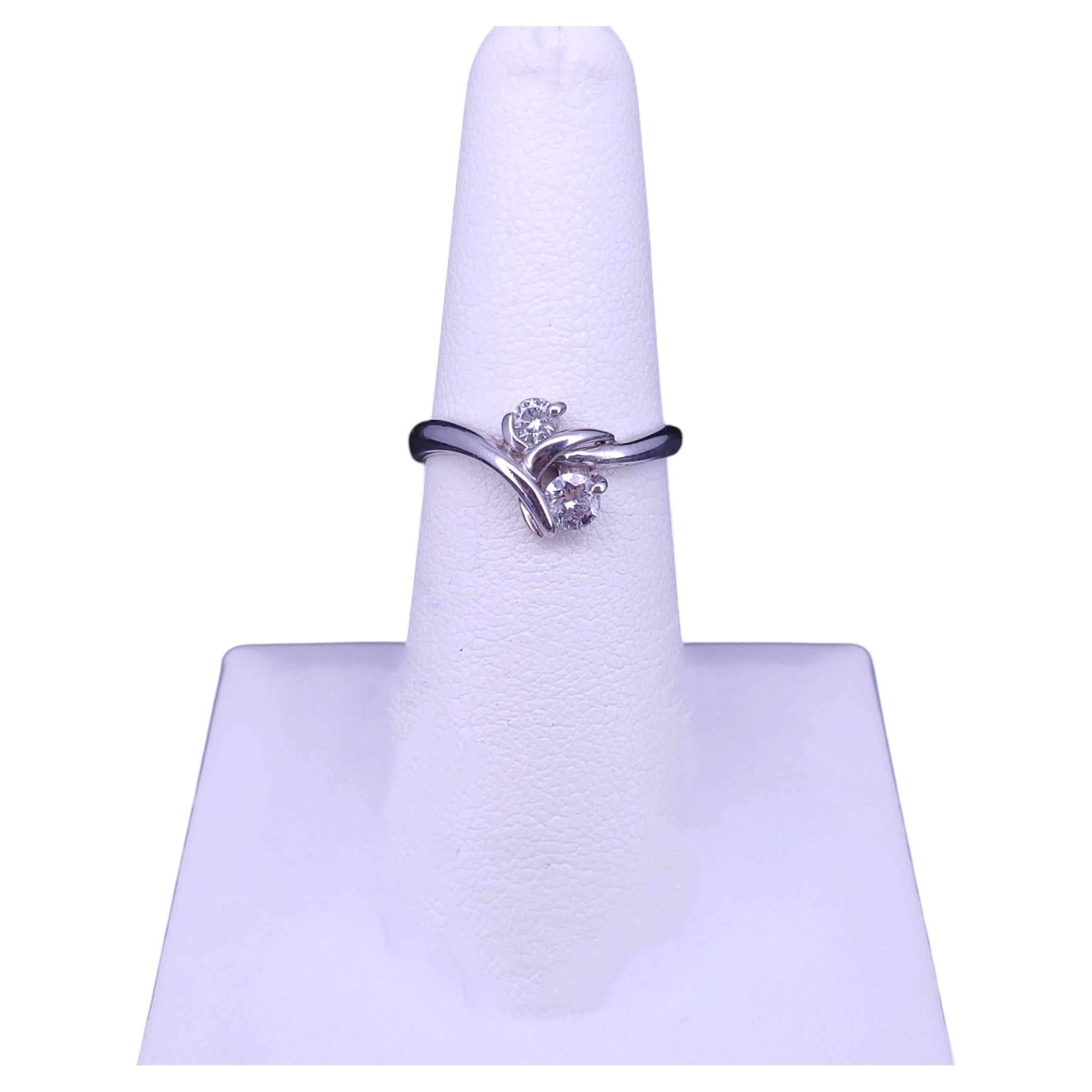Elegant Diamond Bypass Ring with Dual Round Stones For Sale