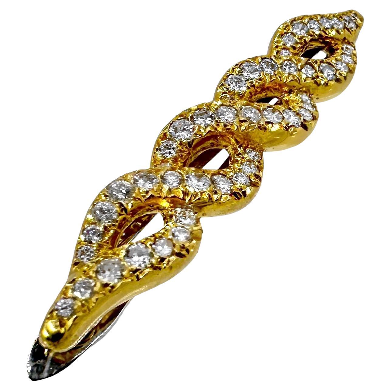This elegant, diamond encrusted  Late-20th Century French Van Cleef & Arpels barette is sure to bring an extra sparkle to the wearer's look, and to the beholder's eye. Crafted in 18k yellow gold and set with forty eight modern brilliant cut diamonds
