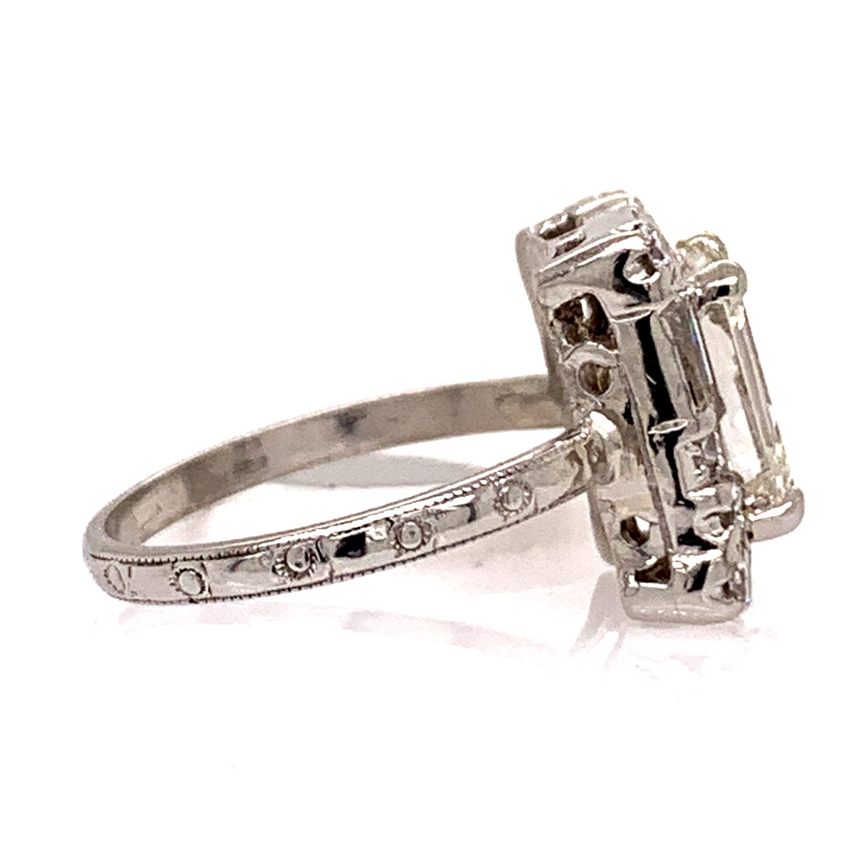 Emerald Cut Elegant Diamond and Platinum Engagement Ring For Sale