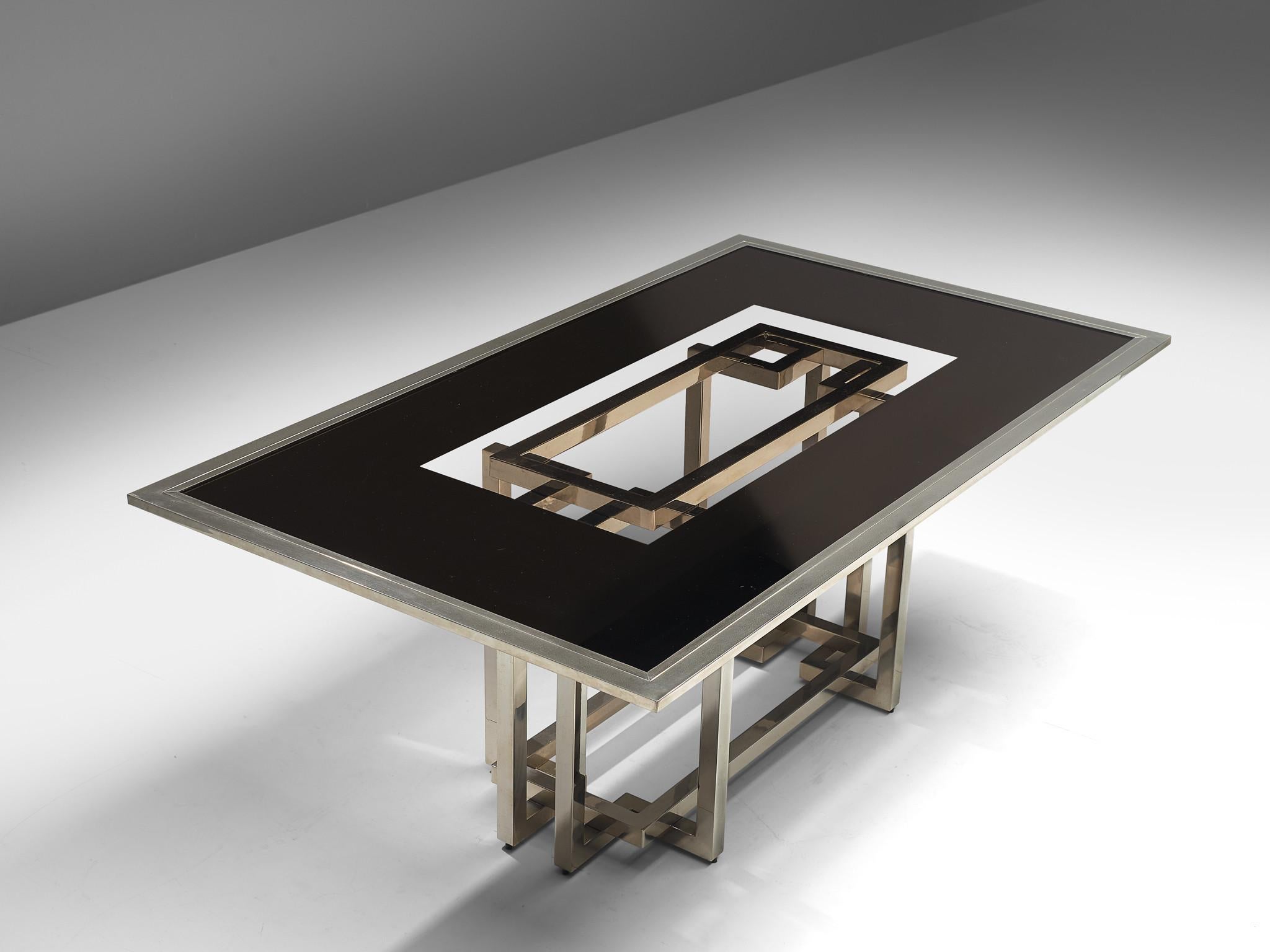Dining table, chromed metal, glass, Europe, 1970s

This eccentric table epitomizes an expressive sculptural base in which you can see the work of a designer and artisan. The composition of the frame is based on right-angles shapes and lines that