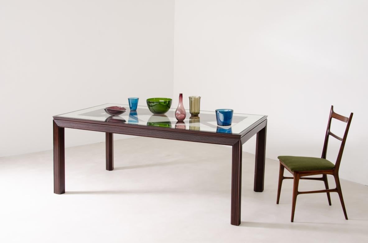 
COD-1753
Elegant dining table with legs and ribbed wood bands and a nice mirrored glass top.

Borsani, Varedo, 1940's.