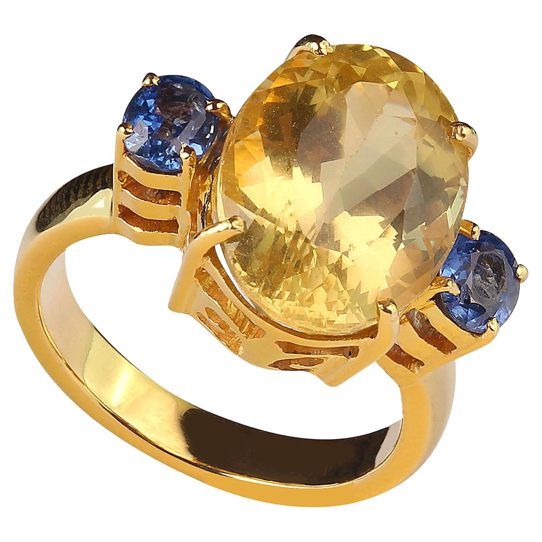 Gorgeous ring of oval light golden Beryl, 7.78 carats and accents of oval Kyanites,0.81 carats total weight. Sizable 7.  See your local jeweler for sizing. This lovely ring is gold rhodium over Sterling Silver which gives it a rich gold tone. The