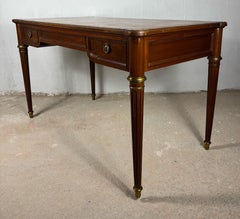 Elegant early 20th century writing desk with brass details and three drawers