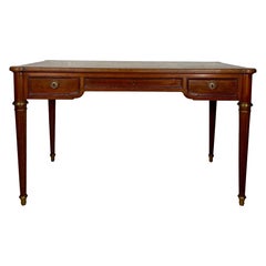 Elegant early 20th century writing desk with brass details and three drawers
