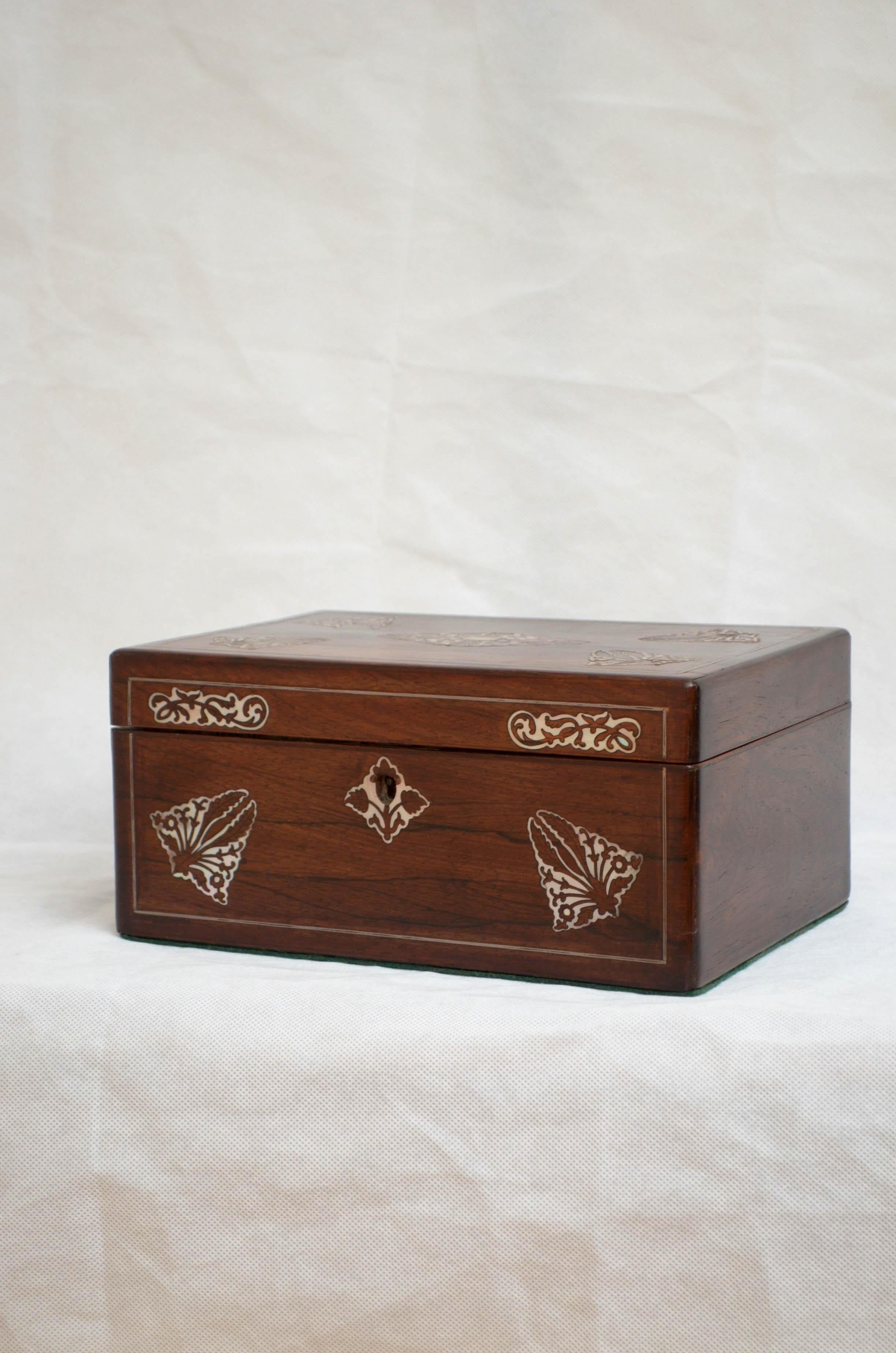 K080 elegant early Victorian rosewood sewing box or jewelry box with beautiful mother of pearl inlaid front and hinged top enclosing new relined interior with lift up tray. This antique box has been sympathetically restored including the interior,