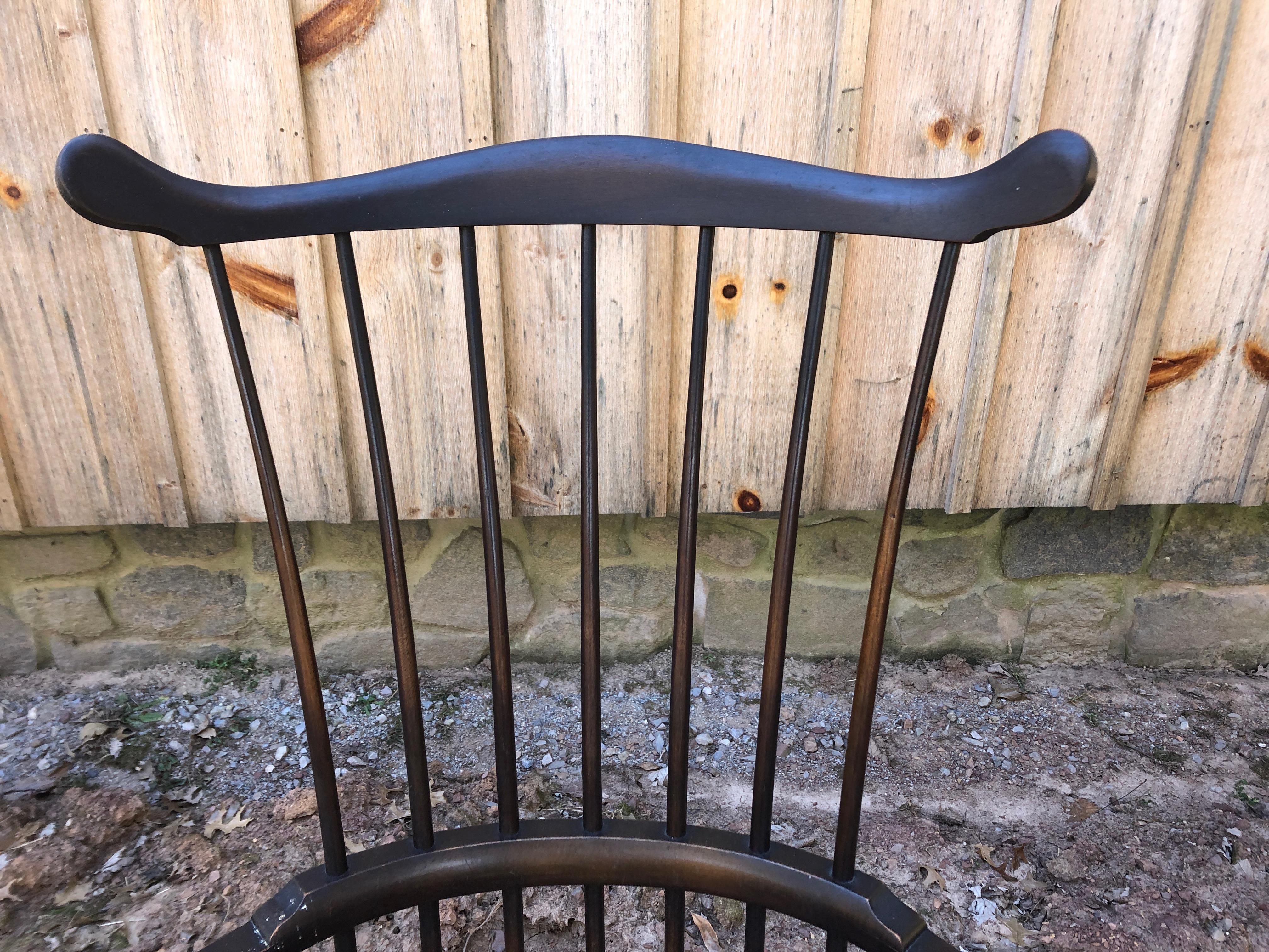 Beautifully crafted and elegant Windsor chair having saddle seat, thin spindles of ebonized wood, comb back and turned legs. By W F Whitney, Ashburnam MA. Circa 1930
Arm height 26.5
Measures: Seat width 21, seat depth 17.25.