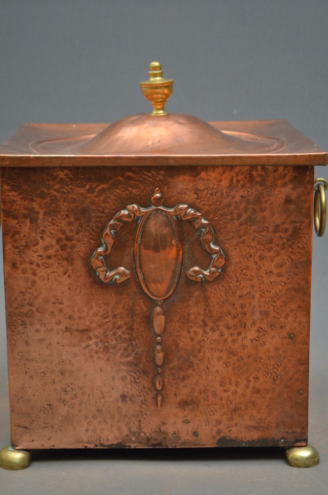 K0195, an attractive Edwardian copper coal bucket / coal bin, with original lid with brass finial, stylish embossed front and original brass handles, all standing on original brass bun feet. All in excellent condition ready to place at home, circa