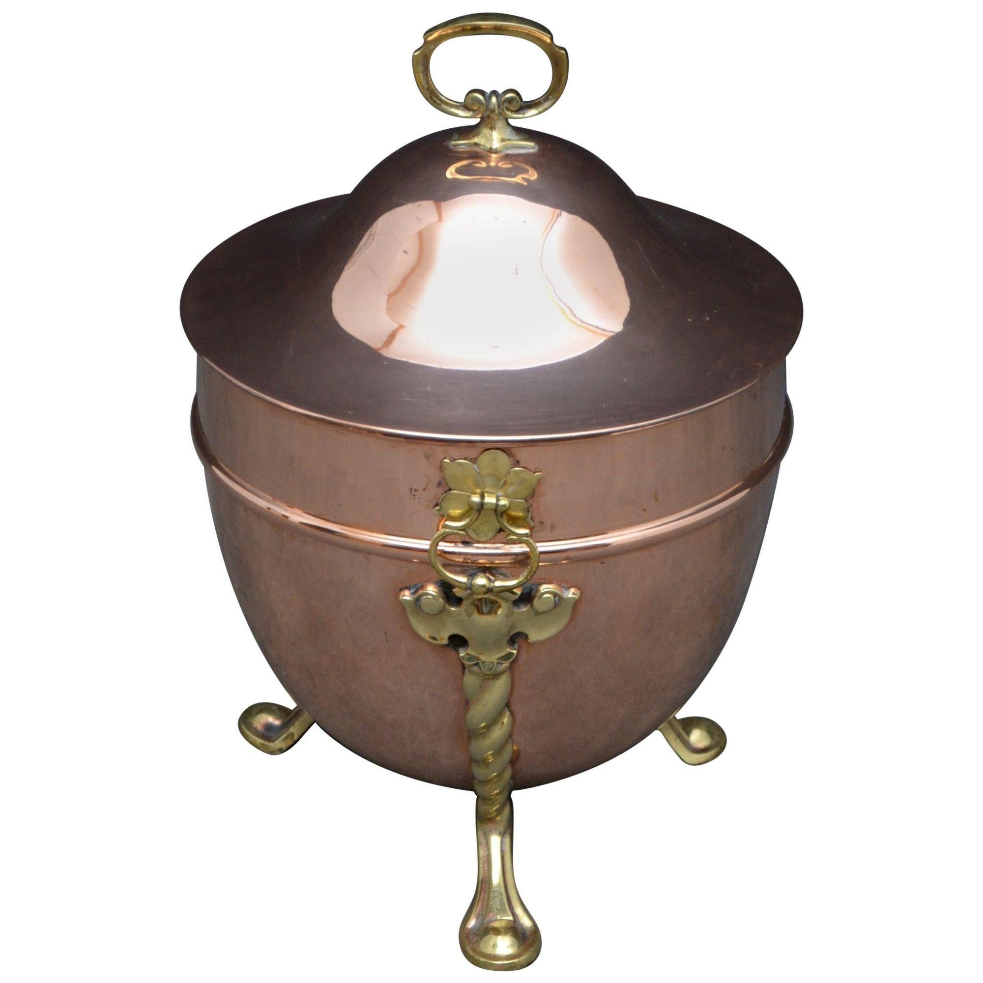 k0060 elegant Edwardian copper coal bin or planter, having lift up lif, 2 handles and 3 decorative legs. This planter has been clean and polished and is ready to place at home, circa 1900.
Measures: Height 17