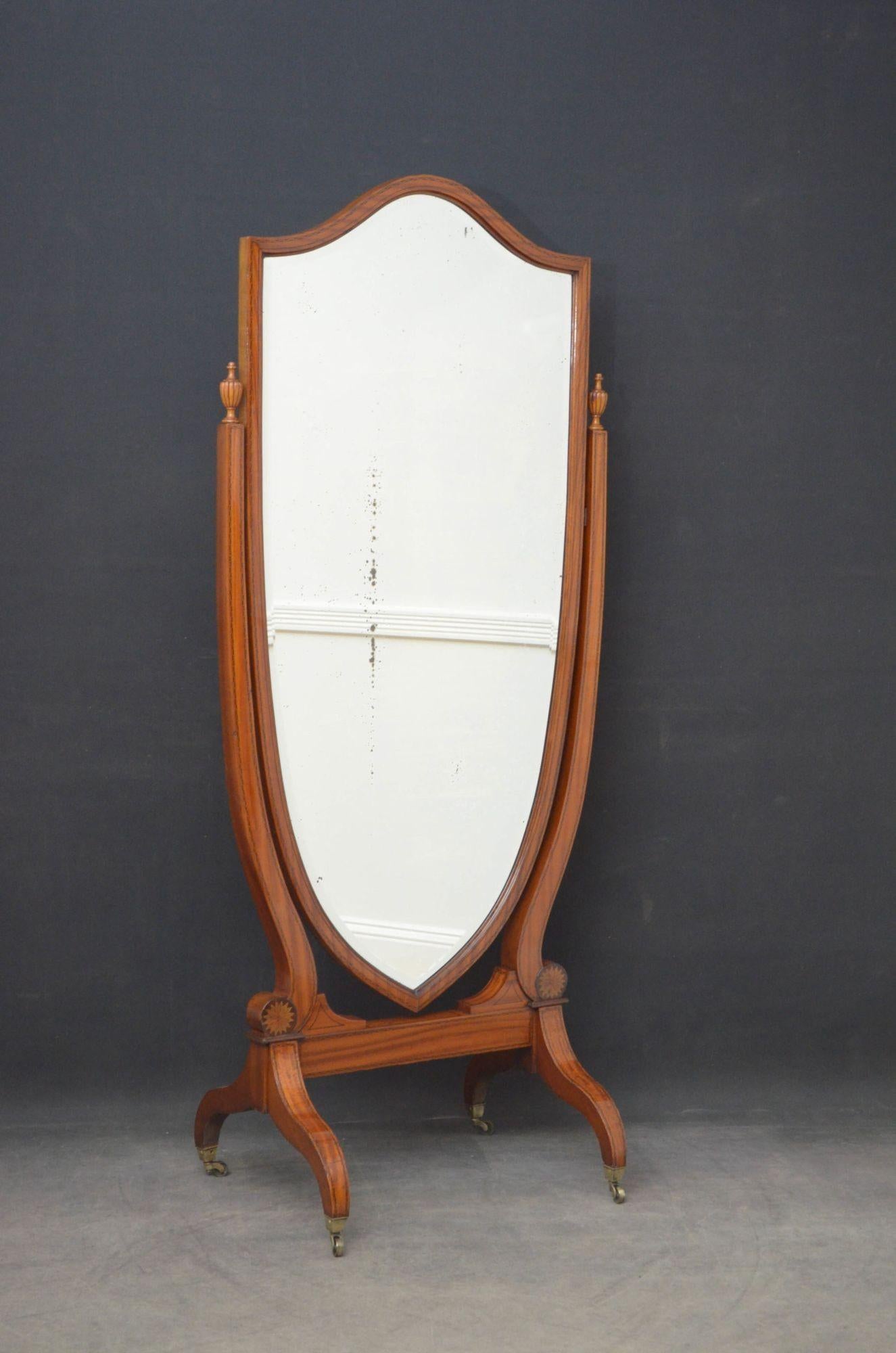 Sn4752 An elegant Edwardian satinwood and inlaid, shield shaped cheval mirror, having original bevelled edge mirror with some silvering in inlaid frame and finely inlaid supports with original fluted finials to top and sun inlays to base, standing