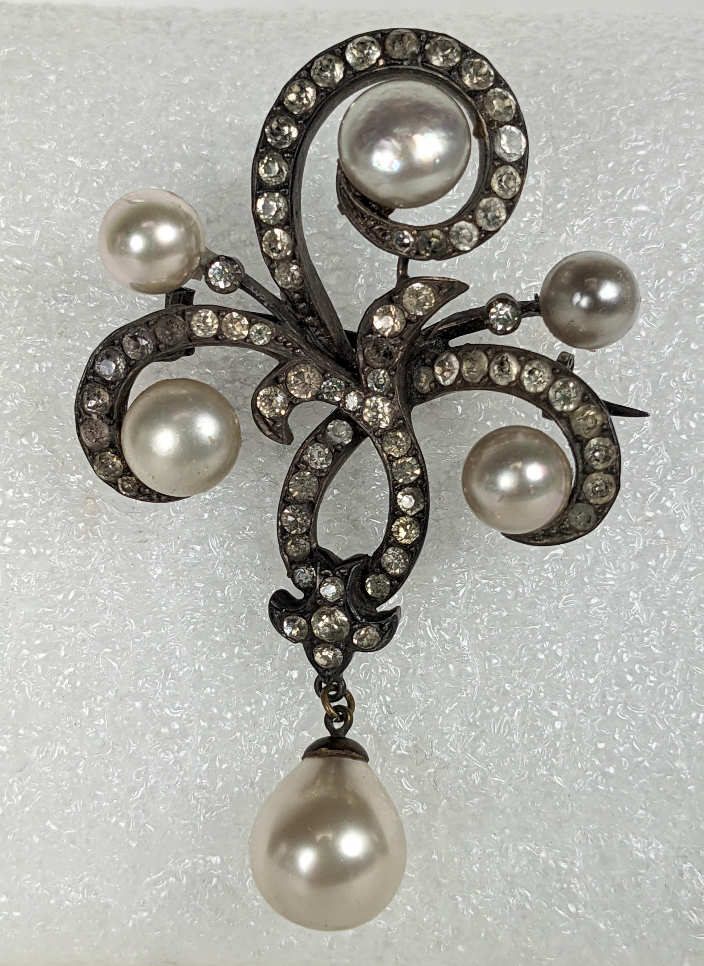 Elegant Edwardian Paste and Faux Pearl Brooch from the late 19th Century set in sterling. Made in France with sterling hallmarks on hook closure. Heavy quality sterling hand set with pastes and faux pearls. 
1890's France. 2.75