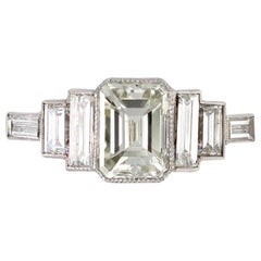 Elegant Emerald-Cut Diamond Ring with Side Baguettes Set in Platinum