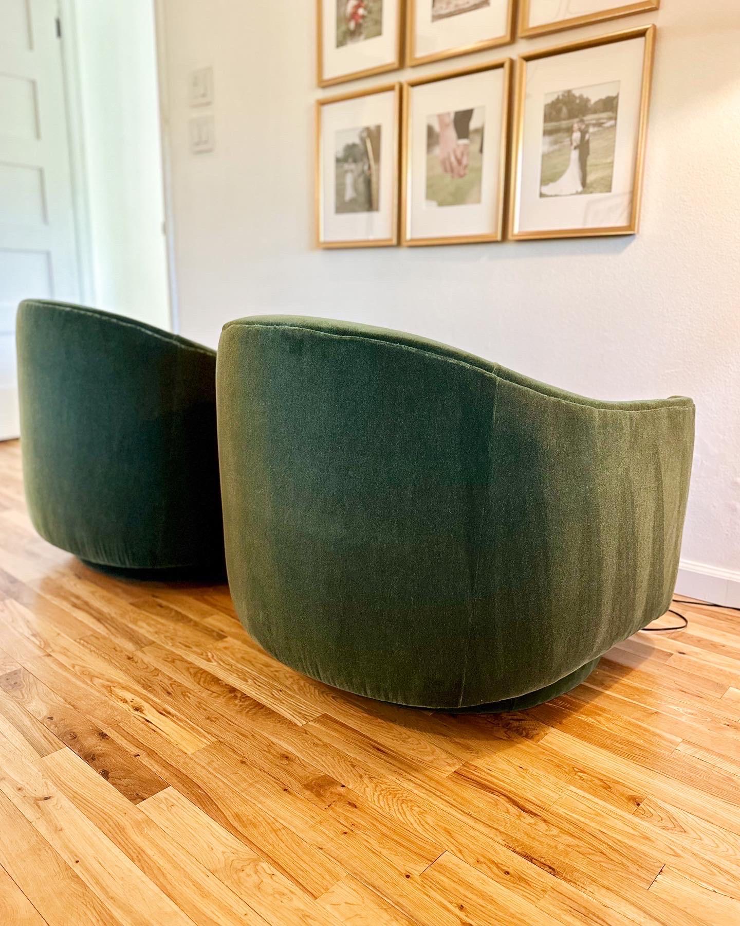 Lush and elegant pair of swivel club chairs by Directional, reupholstered in emerald green mohair, c.1970s. Vibrant yet classic, these beauties will dress up any room. Both chairs swivel and tilt and are in excellent condition with brand new 100%