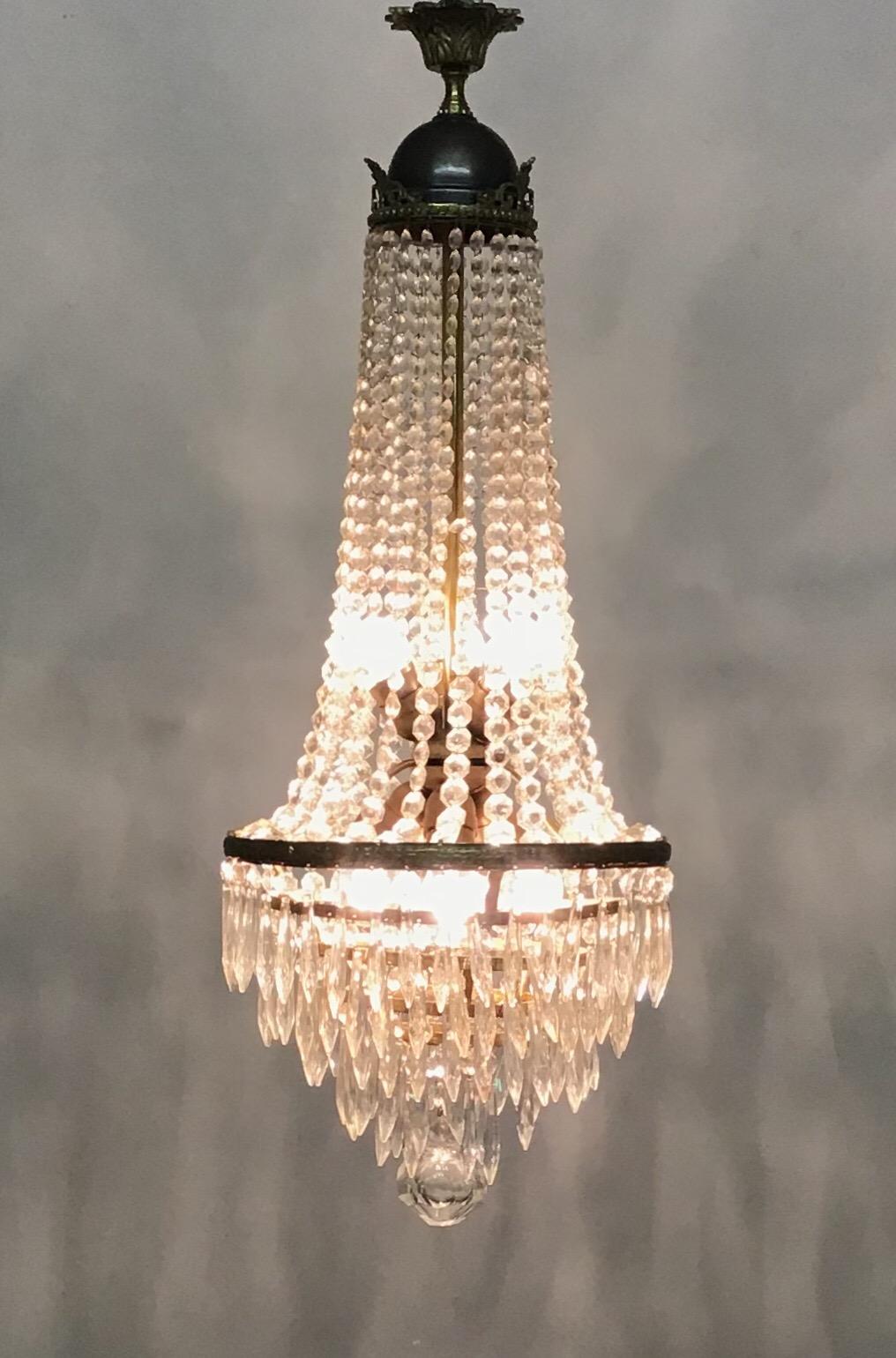 A fine hand - crafted empire style crystal and brass chandelier, Italy, circa 1950s.
Socket: six Edison (e27) for standard screw bulb.
In an excellent condition.
Rewired for US standards.
  