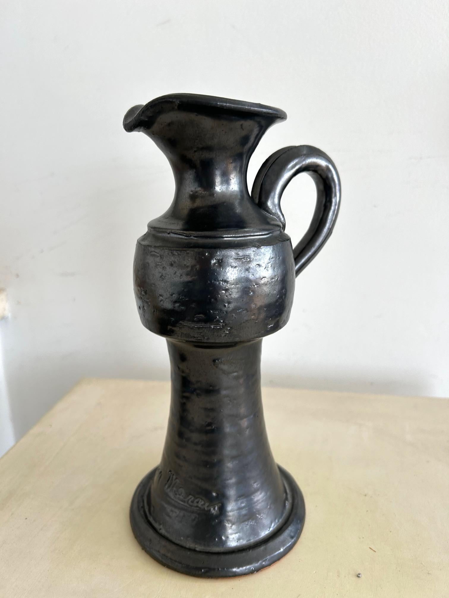 Black glazed ceramic pitcher by Jean Marais dating from the 1960s.
Jean Marais was certainly an actor, but also a painter and ceramic sculptor. In the 1980s, he settled in Vallauris, where he opened a gallery. He rubbed shoulders with Jean Cocteau,