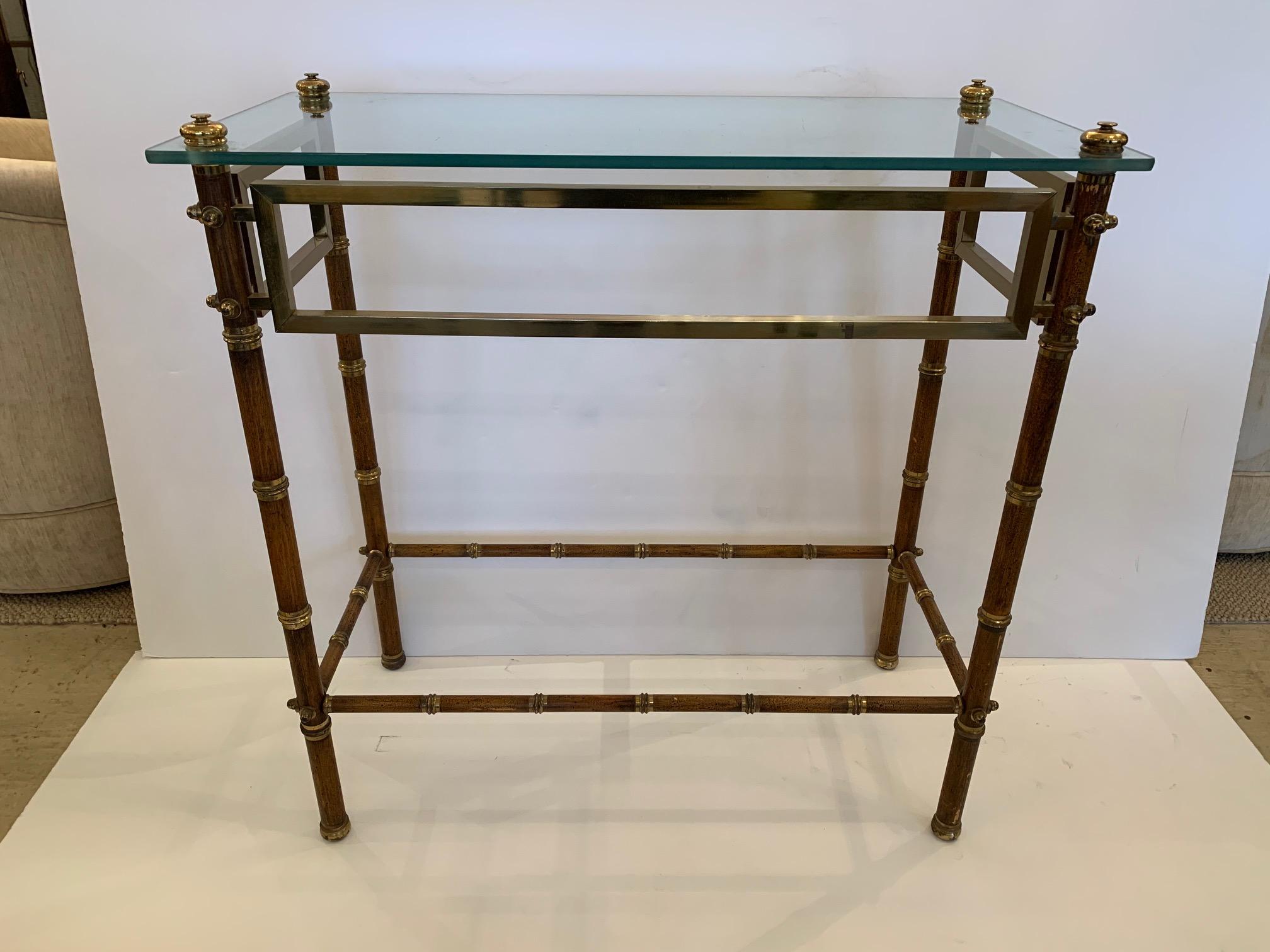 Very sophisticated vintage English brass faux bamboo style console having floating glass top.
  