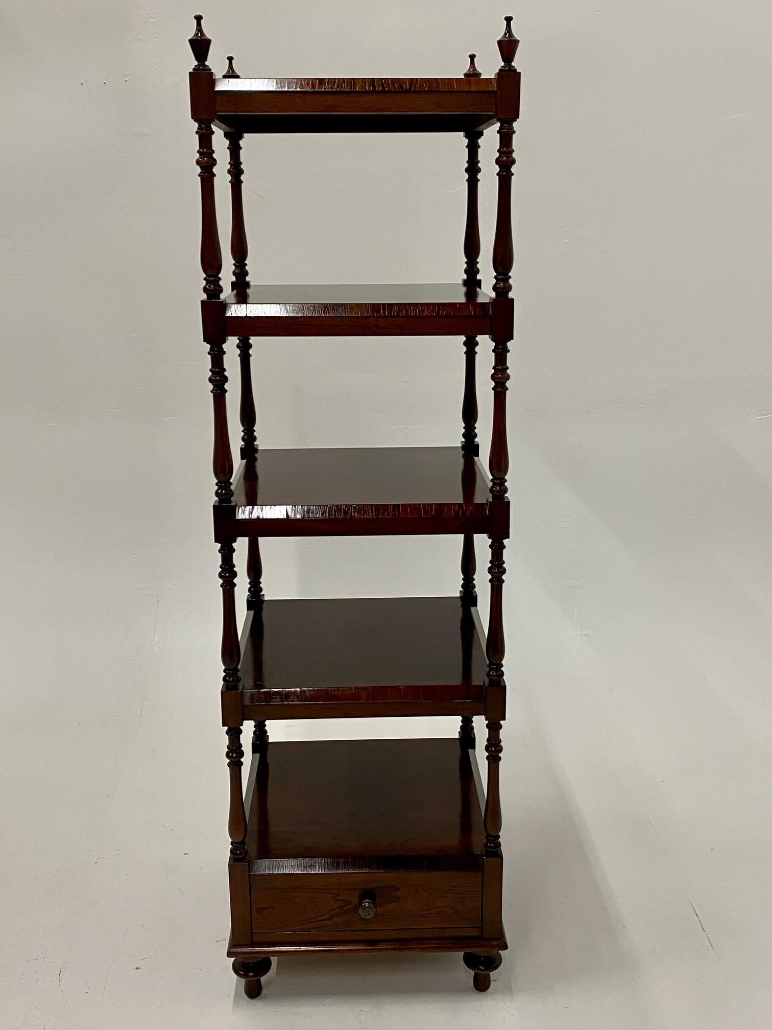 A beautifully made solid rosewood etagere with sumptuous grain having 4 shelves, single drawer in the bottom compartment, and 4 classy finials at the top corners.
60