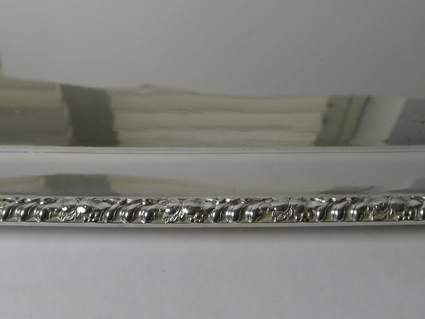 A very smart and elegant drinks or cocktail tray; made from English silver plate and fully marked on the underside by Barker Brothers of Birmingham, dating to the Edwardian era, around 1900 /1910. It is also marked EPNS for Electro-Plated Nickel