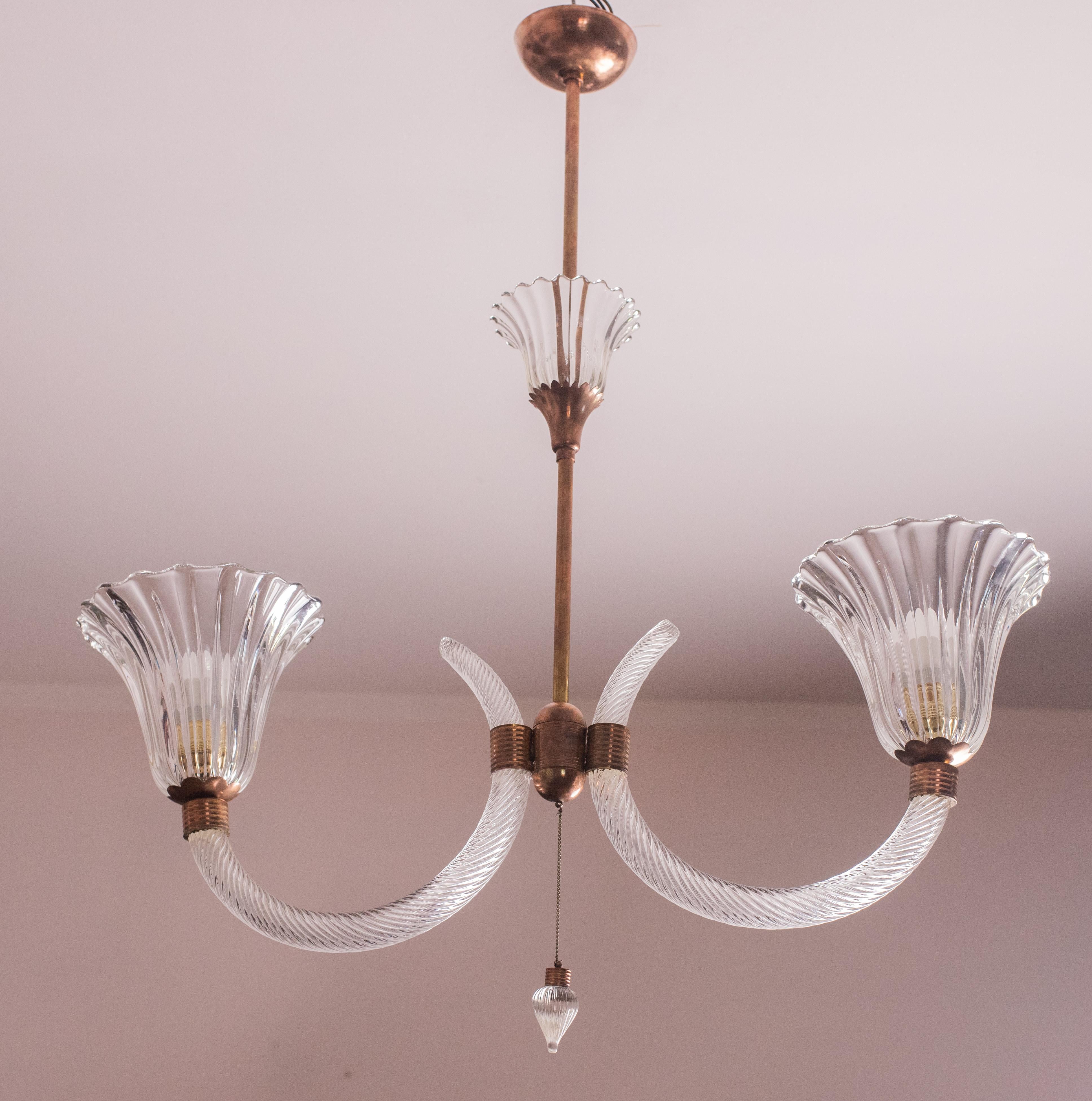 Splendid Art Deco chandelier attribuited to Ercole Barovier made by the glassworks Barovier & Toso in the 1940s-1950s.
The chandelier is 90 cm high and measures 45 cm wide.
It mounts two E27 lights. 
The glass elements make this two-cup pendant