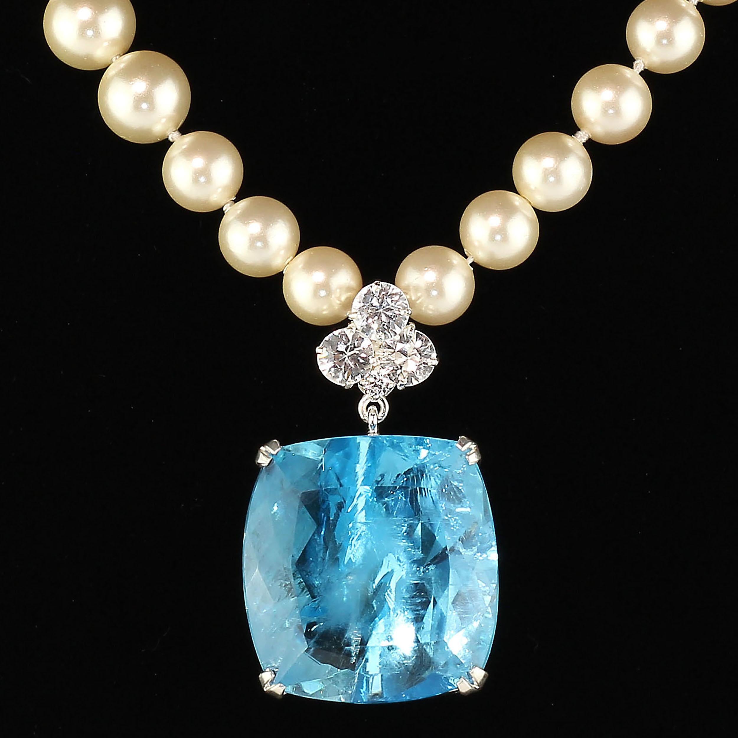 Whopping big Blue Topaz topped with white Cambodian Zircons Pendant for you to wear out for your dinners and dancing.  This gorgeous Brazilian cushion cut Blue Topaz has facinating inclusions that give it life and individuality.  It swings from