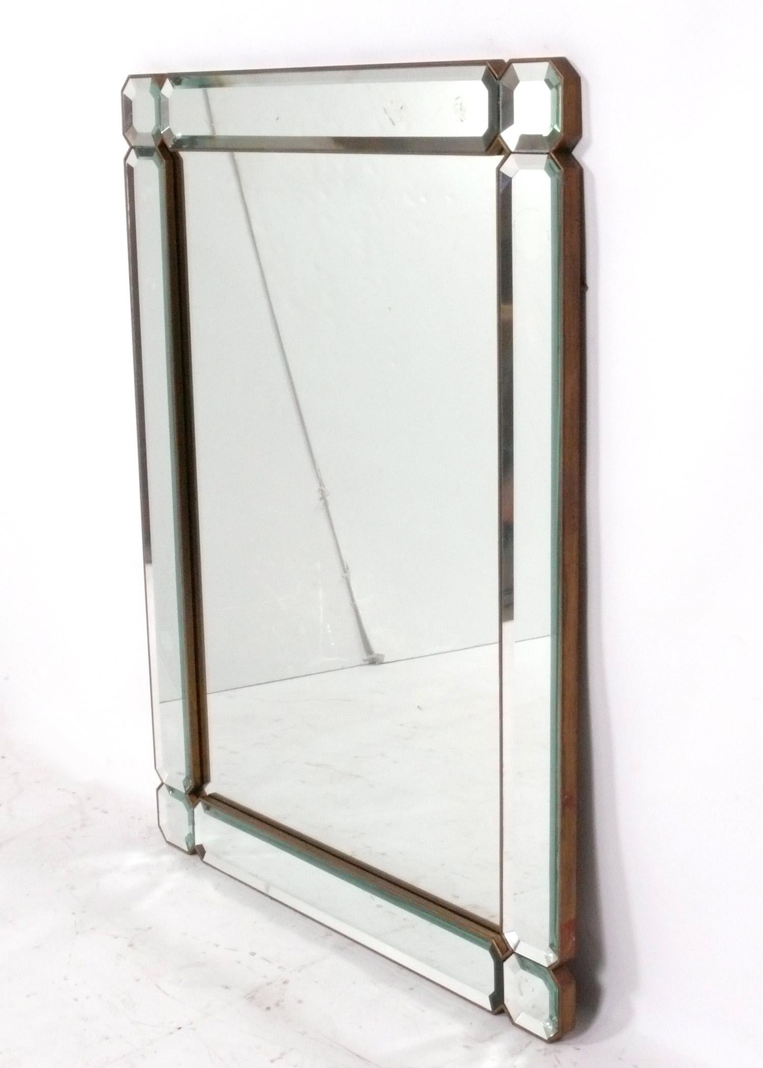 Elegant faceted mirror, American, circa 1950s. It measures 48