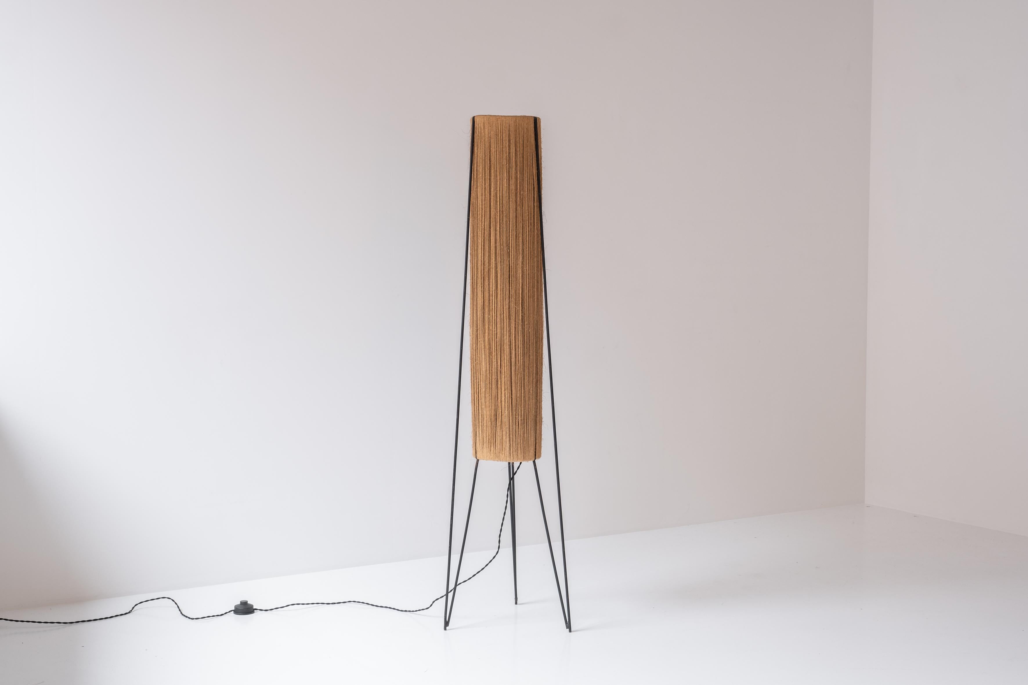 Elegant floor lamp by Hesse-Leuchten from Germany, designed in the 1960s. This rare floor lamp features a black lacquered steel frame with a cylinder cord centre. The design and combination of the two materials making this floor lamp a striking
