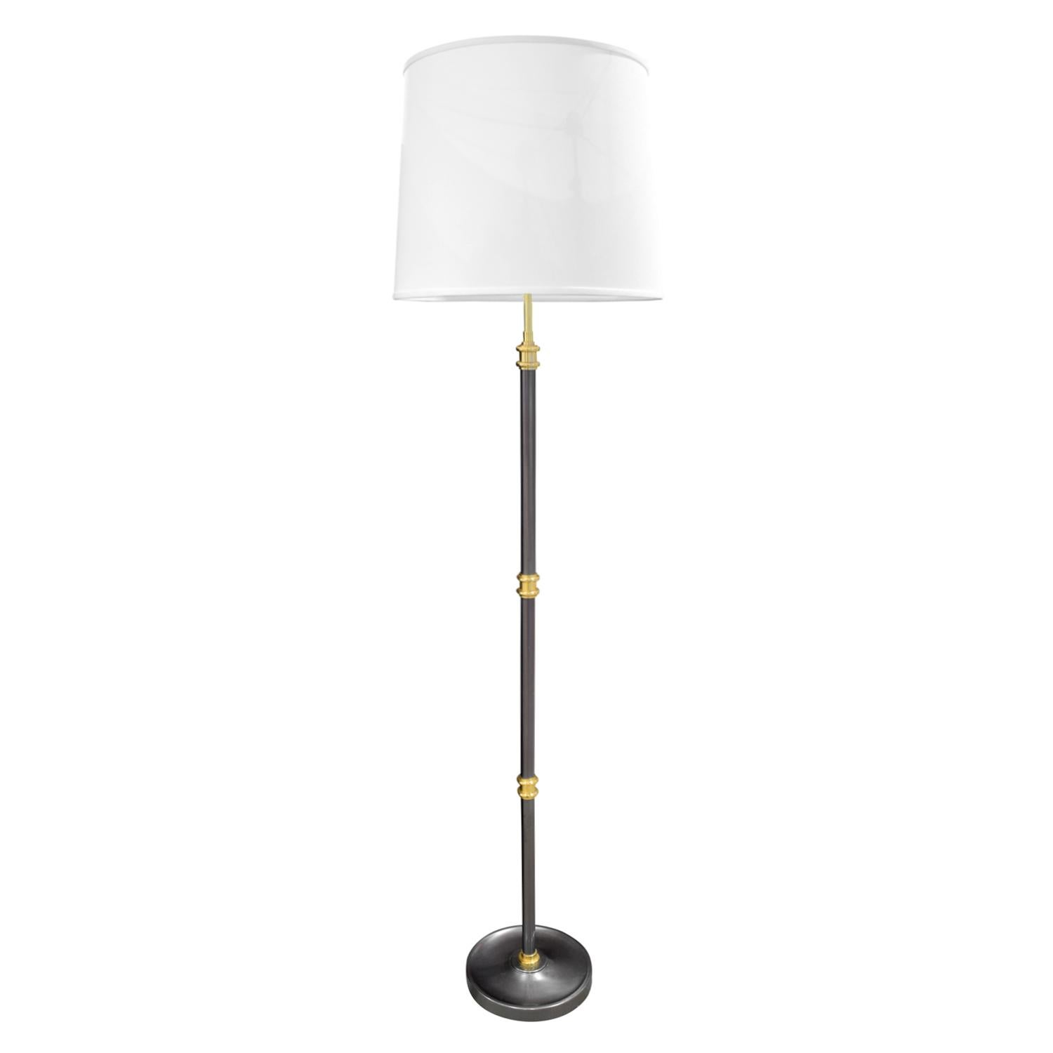 Elegant floor lamp in gunmetal with polished brass accents and ball feet, American, 1980s. This lamp is beautifully made. It has been rewired with new sockets. Height is adjustable.

Measures: Shade diameter 16 inches
Shade height 13 inches.