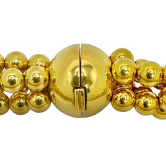 Elegant collier torsade de perles graduées en or jaune 18K à quatre brins