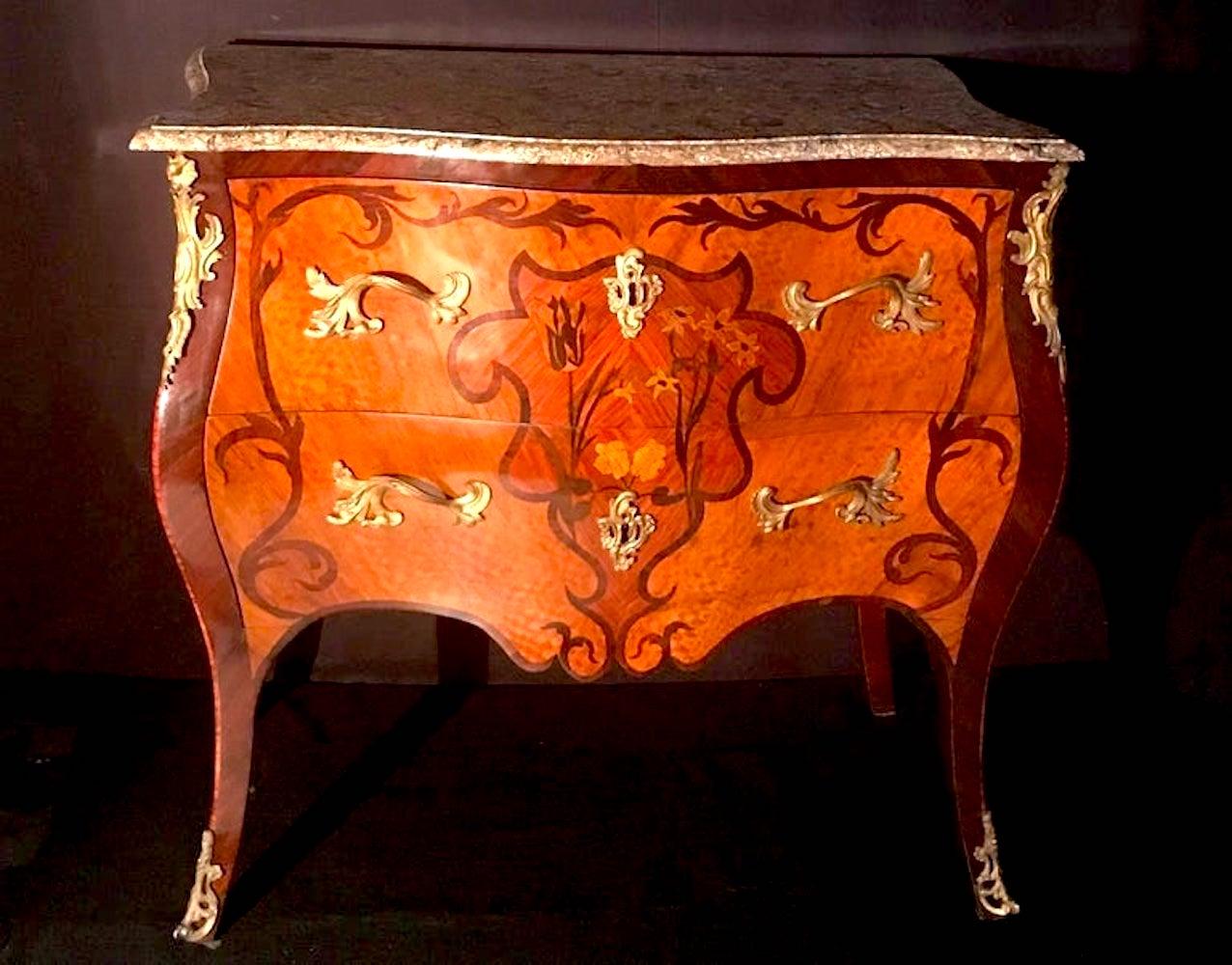 Elegant  Louis XV French 18th century Commode  with 'Lumachella' marble-top above two drawers decorated sans travers and ormolu mounts.
Fine detailed floral inlay with various noble woods. Finely chiseled and gild original bronze fittings.
 Restored